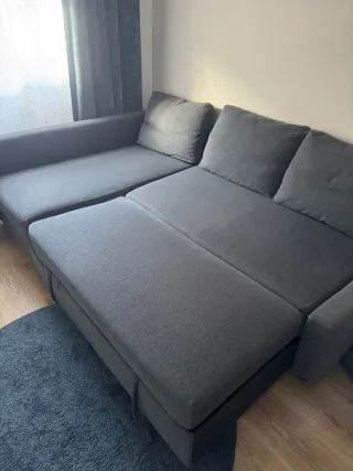 Sofá cama gris con almacenaje