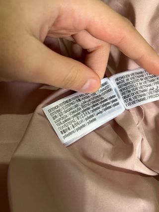 Chaqueta rosa con capucha y pelo