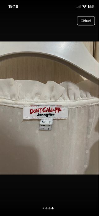 Blusa bianca trasparente con pois