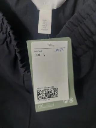 Pantalón señora pata ancha, color gris.