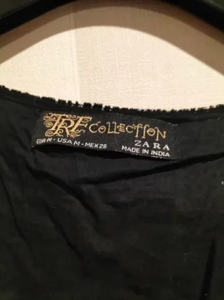 Chaquetilla fiesta lentejuelas negra y dorada.