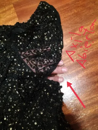 Chaquetilla fiesta lentejuelas negra y dorada.