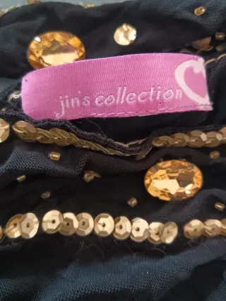 Top nero velato con paillettes dorate