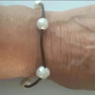 Pulseras de plata y cordón