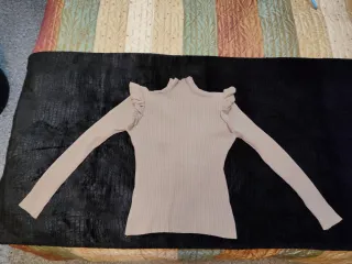 Jersey canalé beige con volantes