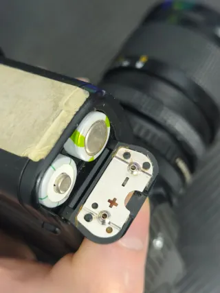 Canon T70 + objetivo.