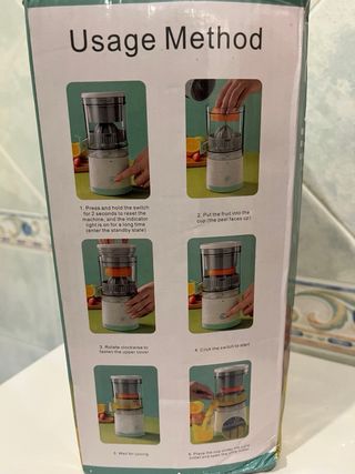 Exprimidor eléctrico blanco y verde