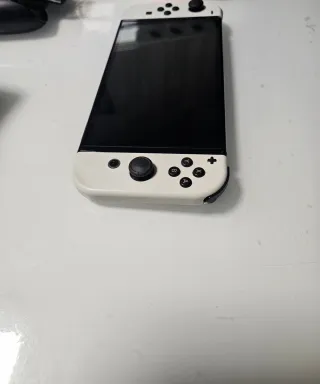 Nintendo Switch OLED + Funda Morada y dos mandos