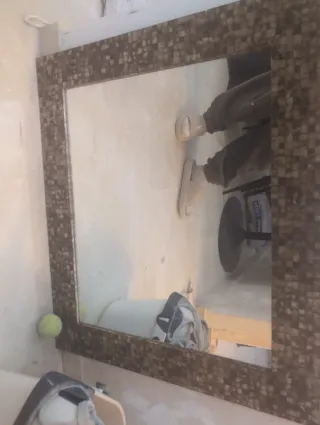 Espejo de entrada con marco de piedra