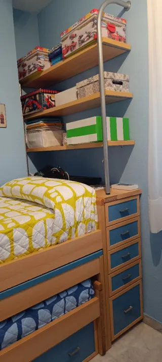 Compacto dos camas nido.