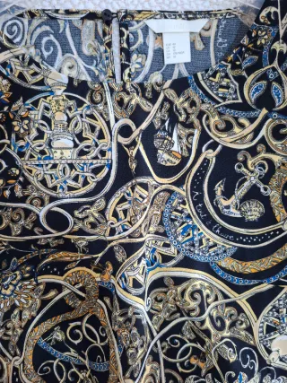 Mini abito manica lunga nero e oro