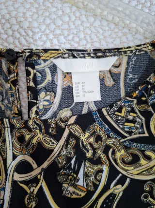 Mini abito manica lunga nero e oro