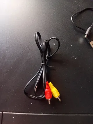 Consola azul con cargador y mando