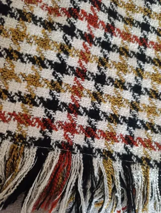 Falda cuadros flecos