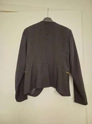 Giacca elegante senza collo con zip dorate