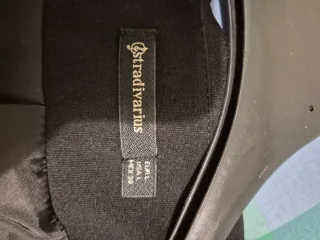 Giacca elegante senza collo con zip dorate