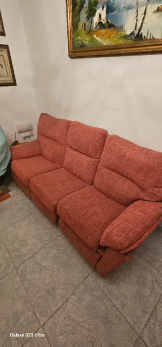 Sofá reclinable naranja de tela