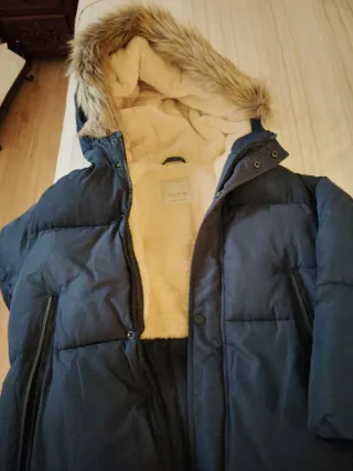 Dos abrigos talla alrededor de 9 -10 años