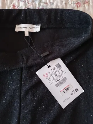 Pantalones campana negros con brillo