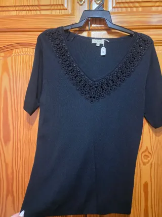 Camisa ZENda viene siendo como una M/L