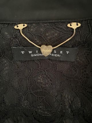 Plumífero negro Twin-Set con pedrería