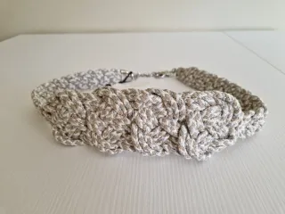 Cinturón Uterqüe trenzado beige y plata