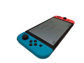 CONSOLA NINTENDO SWITCH OLED 64GB + JOYCONS + GRIP + BASE + CARGADOR + CAJA