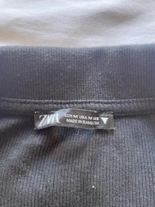 Camiseta top manga larga cuello polo negro