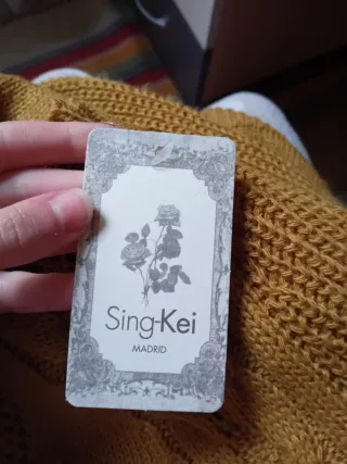 Jersey mostaza con trenzas