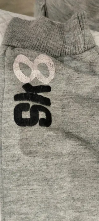 Pantaloni tuta grigi con laccetti arancioni