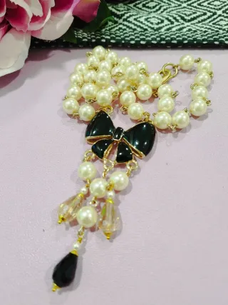Collana di perle lunga 60 cm con fiocco nero