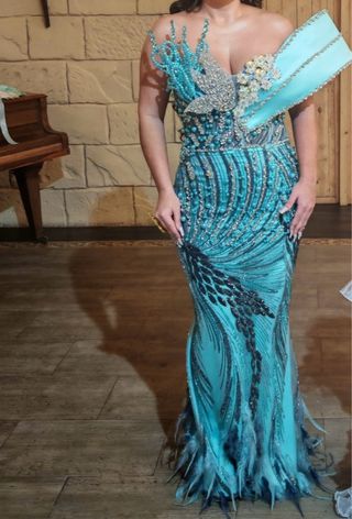 Vestido de fiesta azul turquesa tiene para sacar