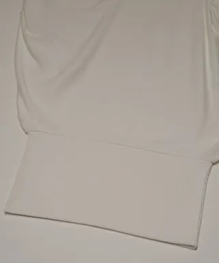 Maglia bianca collo alto e maniche larghe M