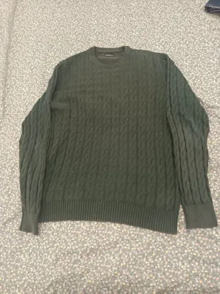 Jersey verde tejido trenzado