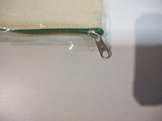 Bolsa de lona con cremallera y asa verde