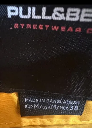 Chubasquero chico impermeable amarillo y negro