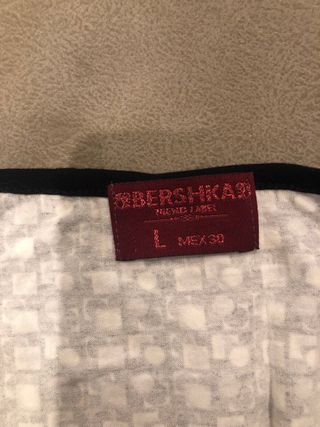 Top halter con purpurina blanco y negro