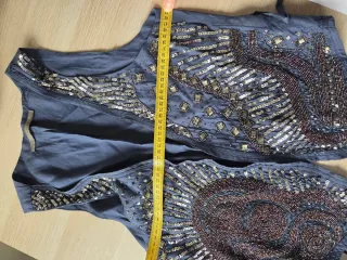 Chaleco Zara con abalorios plateados