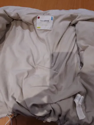 Plumífero anorak corto gris claro