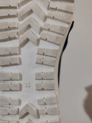 Mocassini neri con frange e zip