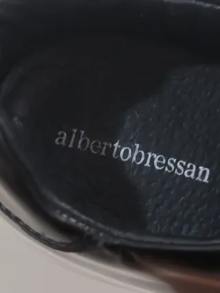 Mocassini neri con frange e zip