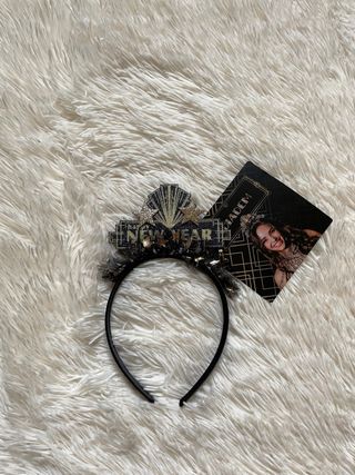 Cerchietto nero e oro con scritta “New Year”