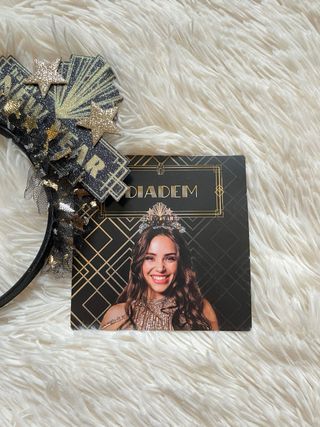 Cerchietto nero e oro con scritta “New Year”