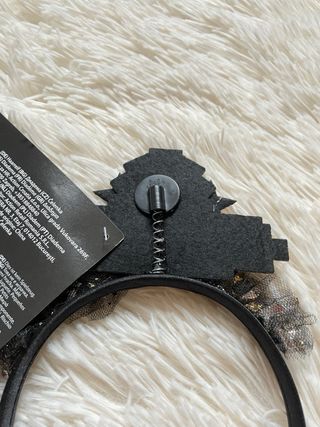 Cerchietto nero e oro con scritta “New Year”