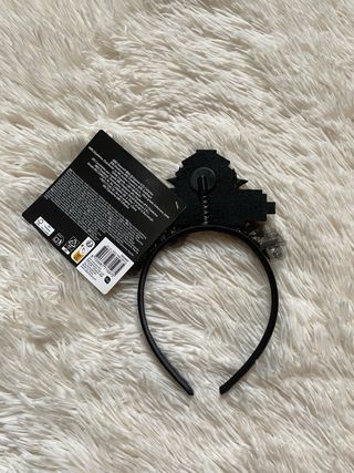 Cerchietto nero e oro con scritta “New Year”