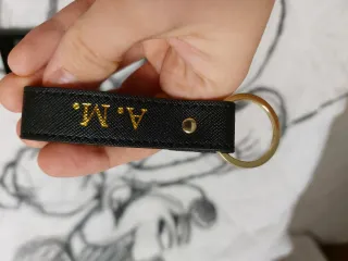 Portafoglio nero con iniziali dorate A.M.