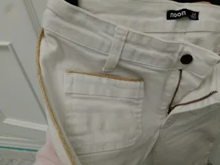 Pantalón blanco flare con flecos