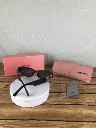 Gafas Miu Miu Negras y doradas
