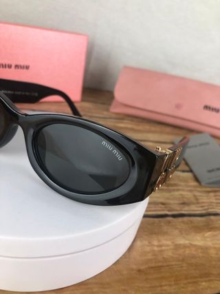 Gafas Miu Miu Negras y doradas