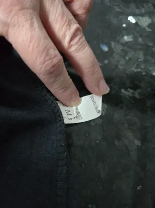 Minifalda negra efecto piel con forro pantalón